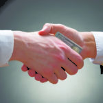 Businesspeople Hands With Money