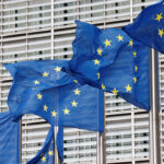 FILE PHOTO: European Union flags flutter outside the EU Commission headquarters in Brussels